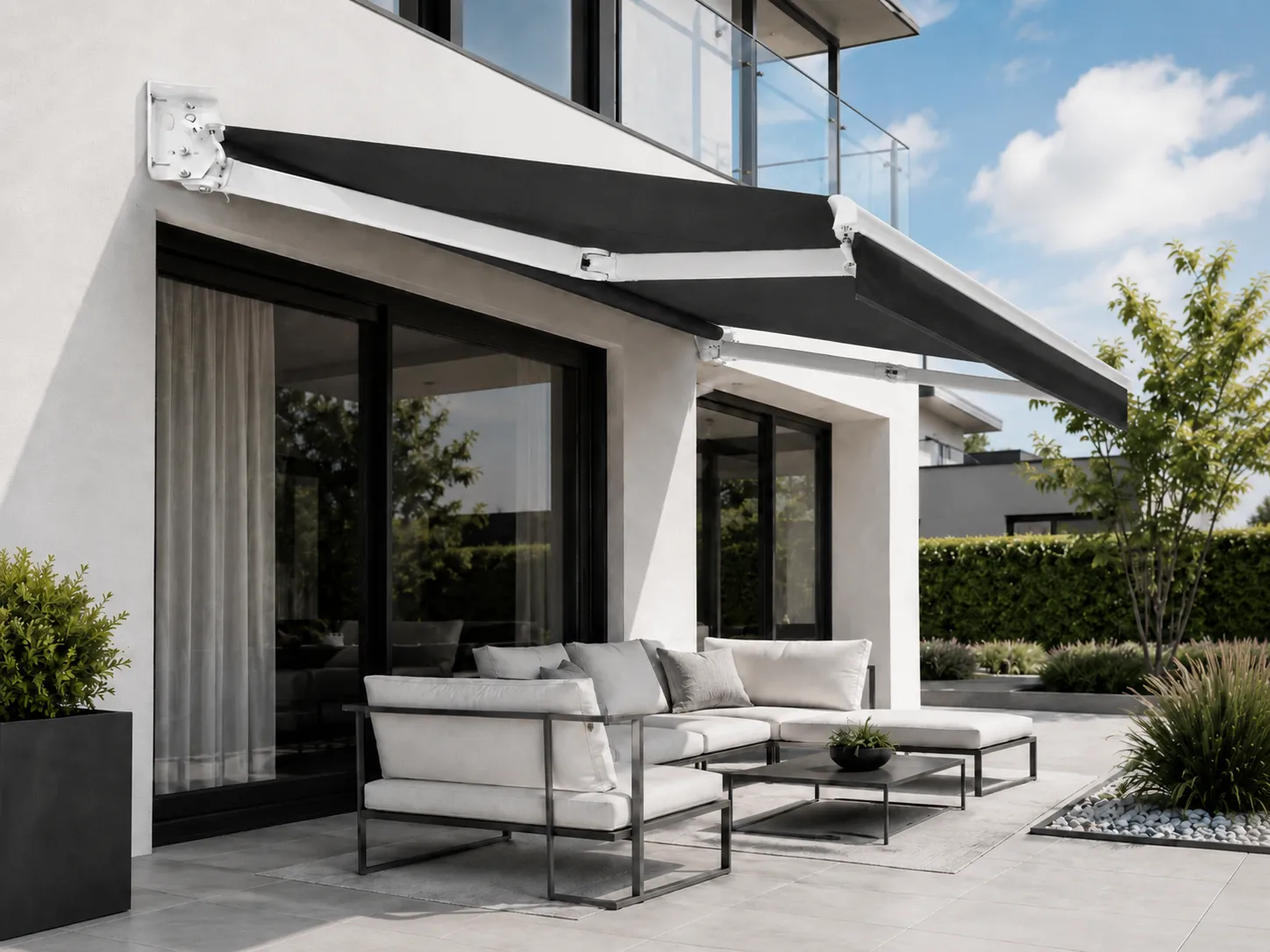 Wall-mounted retractable awning extended over a private patio at a suburban Melbourne home