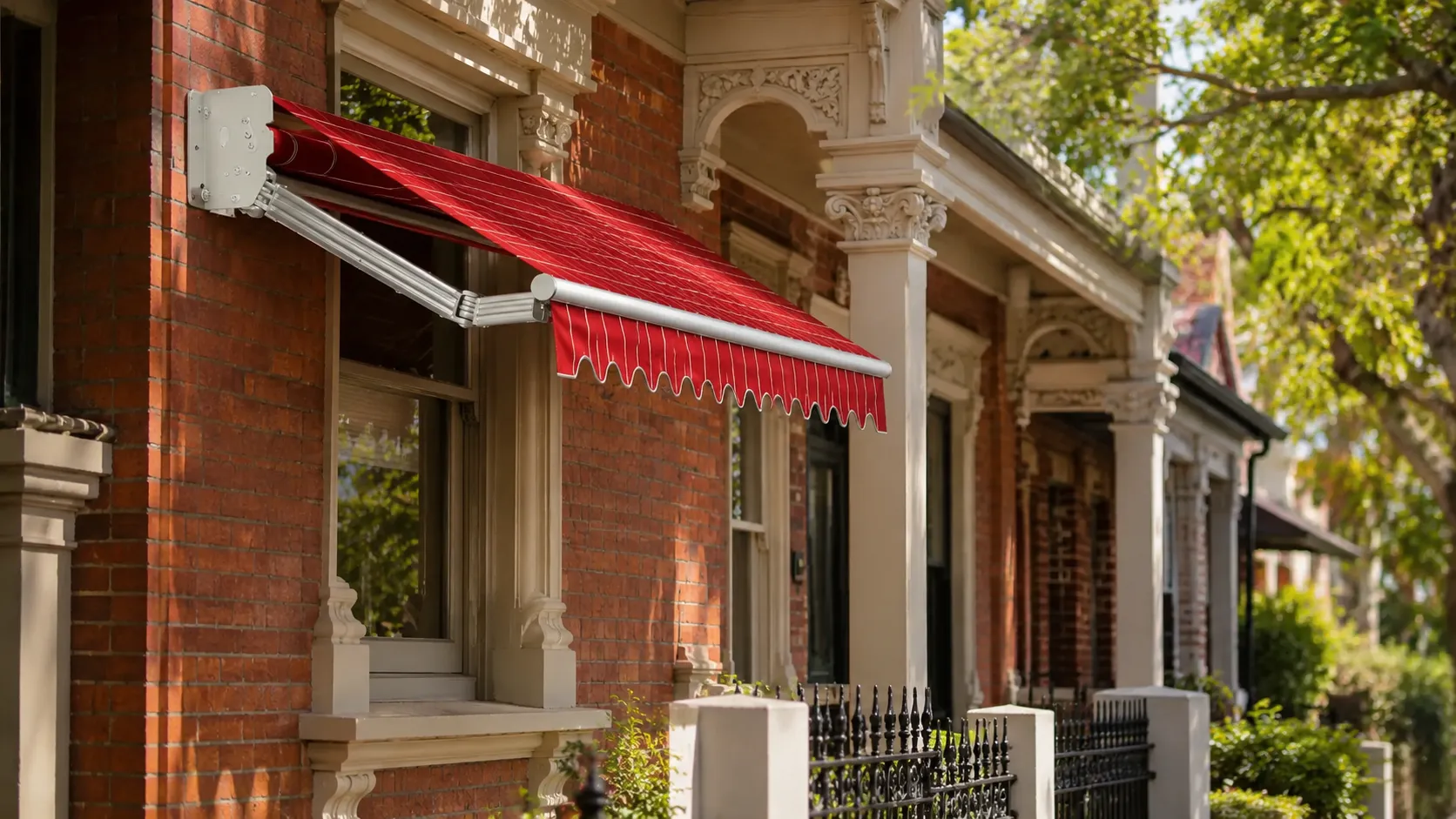 Period-appropriate scalloped retractable awning over the front window of a restored Victorian-era terrace in inner Melbourne