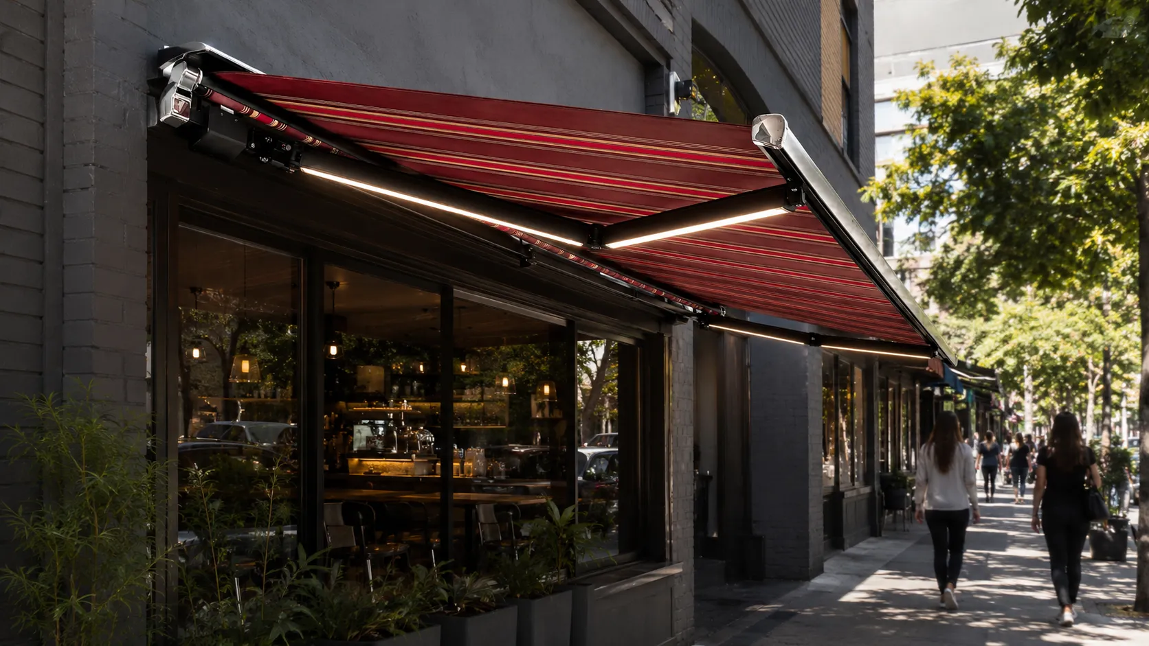 Retractable cassette awning over the footpath of a Melbourne café shopfront