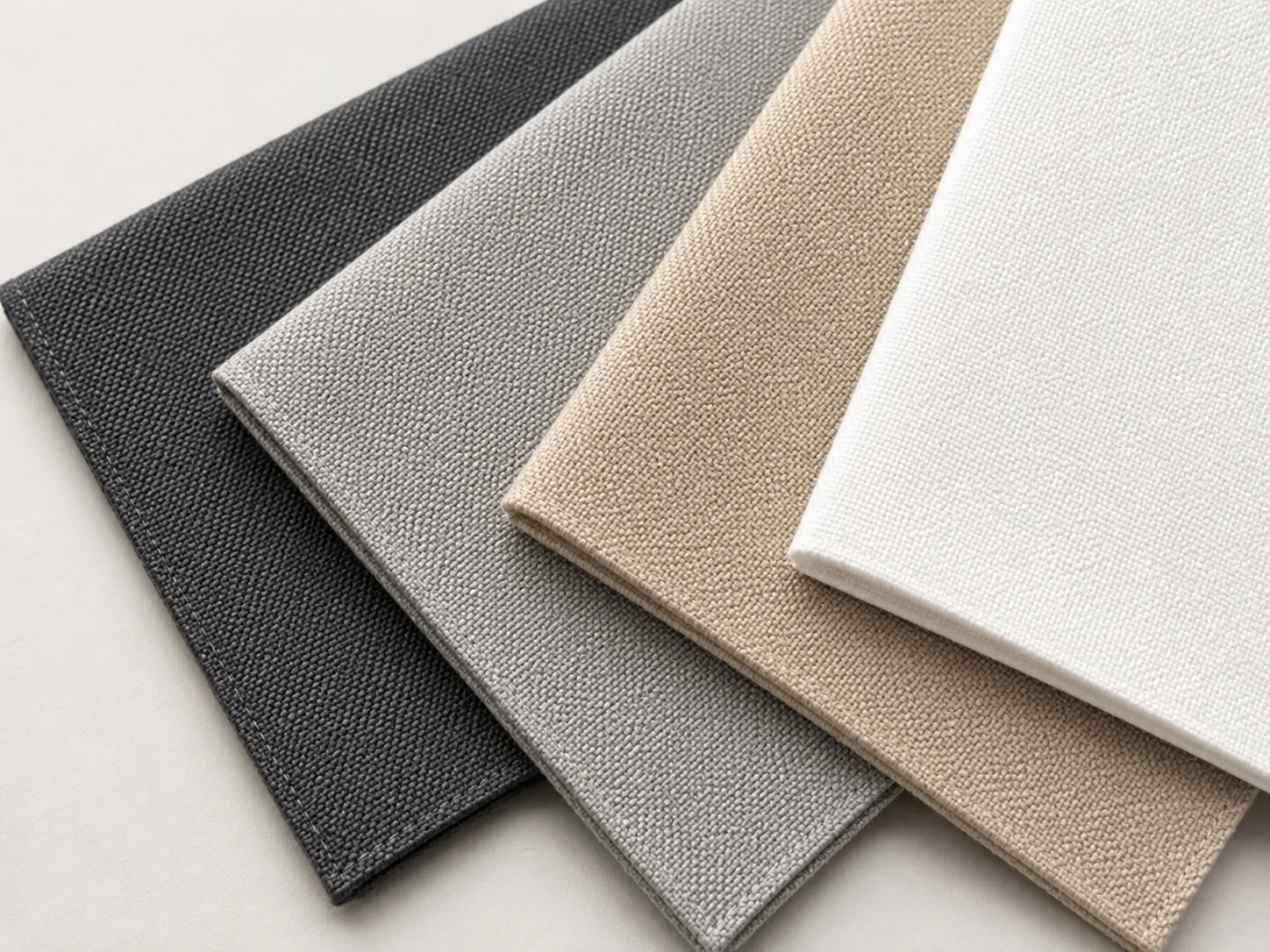 Sauleda awning fabric swatches in five neutral colourways